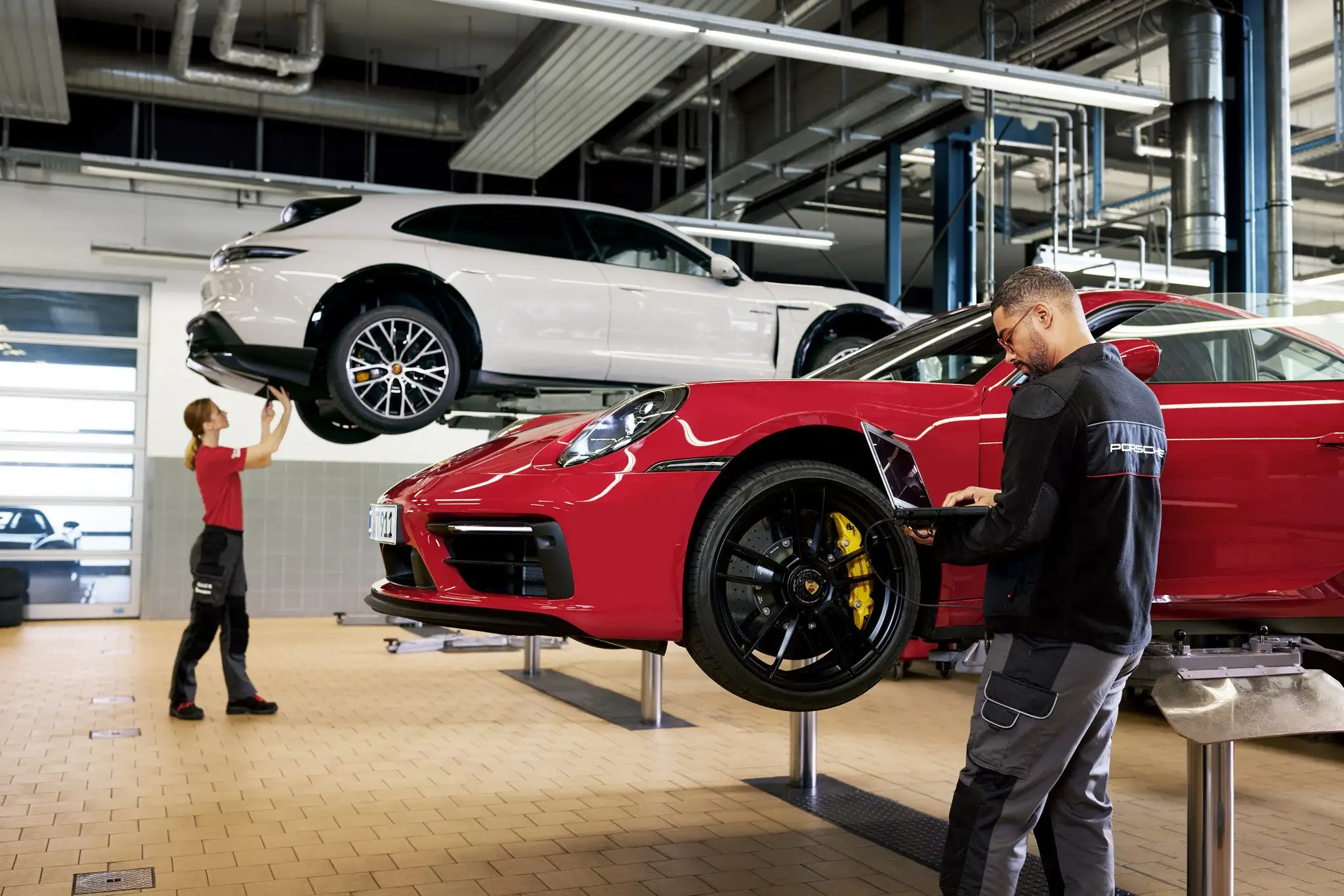 Black Porsche 911 parked in a garage