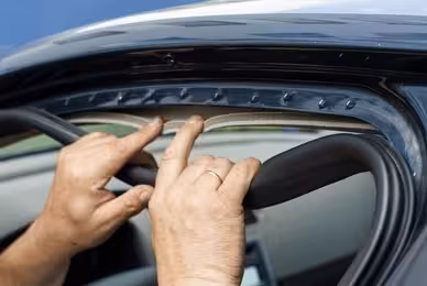 Inspector checking a vehicle door